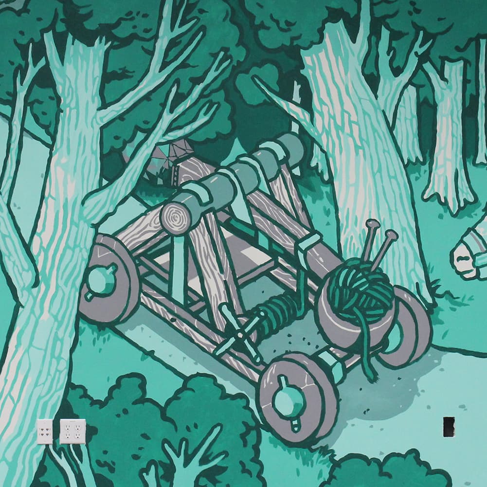 Mural detail: a catapult loaded with a ball of yarn